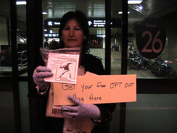 Donna Hancock outside of Phoenix Sky Harbor Airport at 6:00 a.m. handing out TSA 'Opt-Out' b