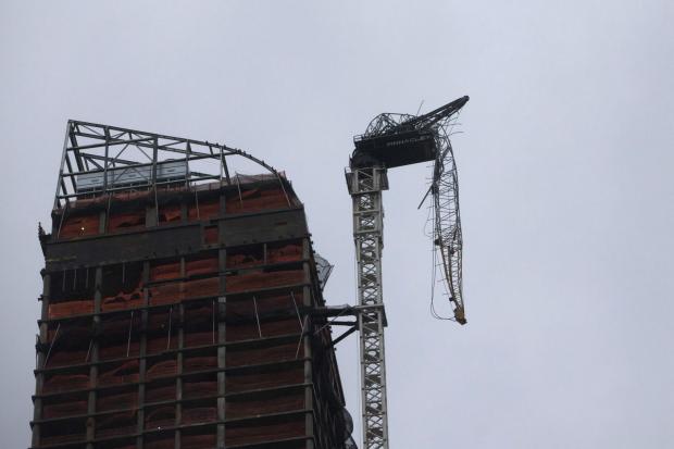 Hurricane Hits: Crane dangles from NYC high-rise, clearing streets